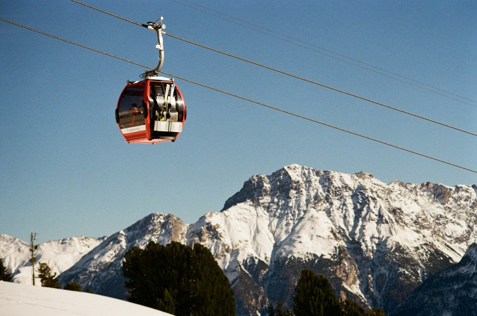 A ski lift going up the side of a mountain