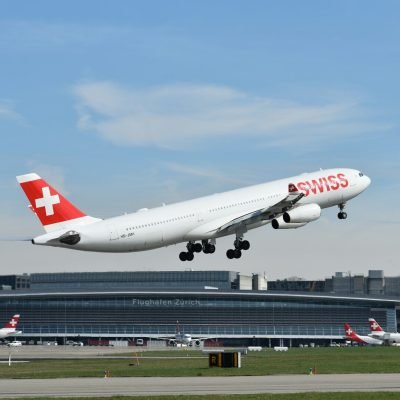 a large passenger jet taking off from an airport runway