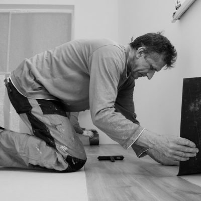 A man laying on the floor in a room